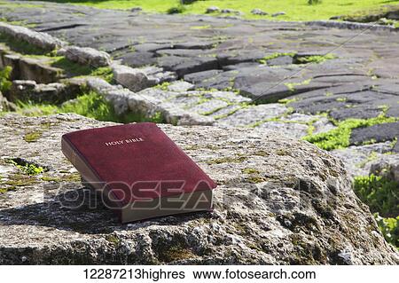 Bible sitting on an old rock at an ancient ruins site; Tarsus, Turkey View Large Photo Image Stock Photograph - Bible sitting on an old rock at an ancient ruins site; Tarsus, Turkey. Fotosearch