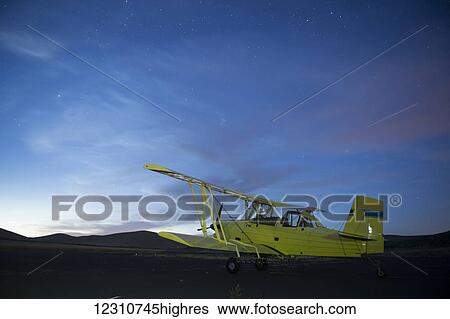 Stock Photograph - Biplane crop duster; Palouse, Washington, United States of America. Fotosearch