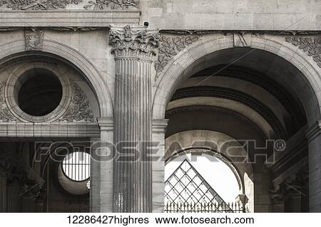 Black and white image of architectural details of a passage under one of the buildings at the Louvre palace, the tip of the main pyramid is visible in the distance through the passage opening; Paris, France View Large Photo Image Stock Photograph - Black and white image of architectural details of a passage under one of the buildings at the Louvre palace, the tip of the main pyramid is visible in the distance through the passage opening; Paris, France. Fotosearch