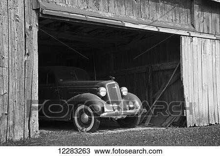 Black and white image of the front of an antique car inside a wooden barn; Frankford, Ontario, Canada View Large Photo Image Stock Image - Black and white image of the front of an antique car inside a wooden barn; Frankford, Ontario, Canada. Fotosearch