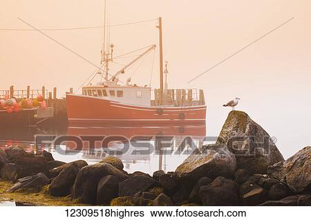 Stock Photograph - Boat at Bear Point Wharf on a foggy morning; Bear Point, Nova Scotia, Canada. Fotosearch