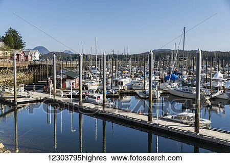 Stock Photograph - Boats docked in the small boat harbor in downtown Ketchikan, Southeast Alaska, USA, Spring. Fotosearch