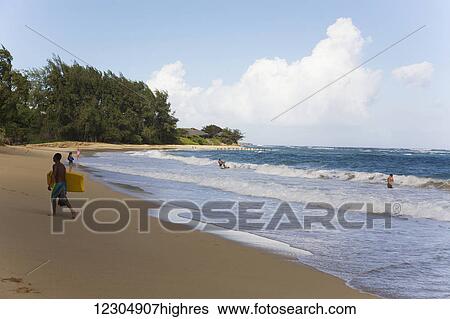 Boogie boarders enjoying the waves at Laie Beach Park on the north shore of Oahu; Oahu, Hawaii, United States of America View Large Photo Image Stock Photograph - Boogie boarders enjoying the waves at Laie Beach Park on the north shore of Oahu; Oahu, Hawaii, United States of America. Fotosearch