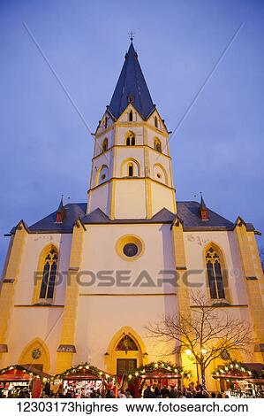 Booths of the Christmas market vendors in front of the cathedral; Altenahr, Nordrhein Westfalen, Germany View Large Photo Image Stock Photograph - Booths of the Christmas market vendors in front of the cathedral; Altenahr, Nordrhein Westfalen, Germany. Fotosearch