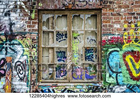 Broken window in an abandoned building covered in graffiti; Stockholm, Sweden View Large Photo Image Stock Photograph - Broken window in an abandoned building covered in graffiti; Stockholm, Sweden. Fotosearch