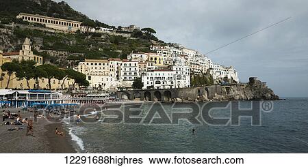 Stock Photograph - Buildings and a beach along the Amalfi coast; Amalfi, Campania, Italy. Fotosearch