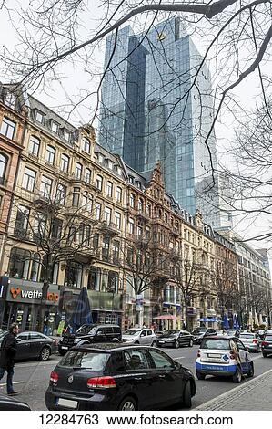 Buildings, pedestrians and cars in the street in a busy city; Frankfurt, Germany View Large Photo Image Stock Image - Buildings, pedestrians and cars in the street in a busy city; Frankfurt, Germany. Fotosearch