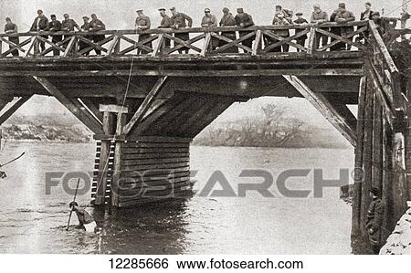 Stock Photograph - Bulgarian soldiers fishing for guns in the river at Nish, or NiÃƒâ€¦Ã‚Â¡, Serbia, after the Serb evacuation in 1916. From The Pageant of the Century, published 1934. Fotosearch