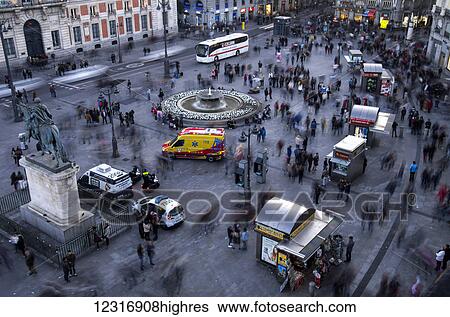 Stock Photograph - Busy town square; Madrid, Spain. Fotosearch