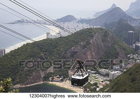 Stock Photograph - Cable car station at Sugarloaf Mountain looking to Tiburcio Beach and Copacabana Beach; Rio de Janeiro, Brazil. Fotosearch