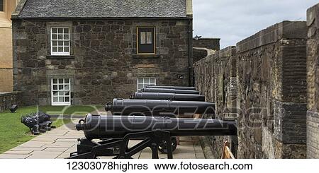 Cannons lined up against a stone wall at Stirling Castle; Stirling, Scotland View Large Photo Image Stock Photograph - Cannons lined up against a stone wall at Stirling Castle; Stirling, Scotland. Fotosearch
