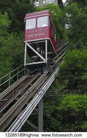 Stock Photograph - Cape Fox funicular takes passengers up to a hotel and restaurant from Creek Street, Ketchikan, Southeast Alaska, summer. Fotosearch