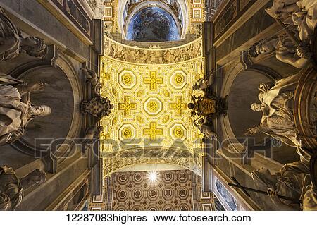Stock Photograph - Ceiling and statues in St. Peter's Basilica; Rome, Italy. Fotosearch