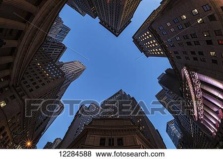 Center of Wall Street at twilight; New York City, New York, United States of America View Large Photo Image Stock Photo - Center of Wall Street at twilight; New York City, New York, United States of America. Fotosearch