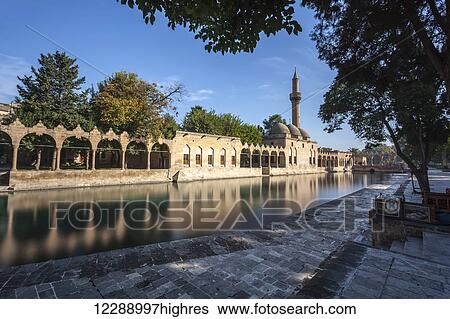 Chamber of Abraham and a minaret reflected in the tranquil water of a lake; Sanliurfa, Turkey View Large Photo Image Stock Photograph - Chamber of Abraham and a minaret reflected in the tranquil water of a lake; Sanliurfa, Turkey. Fotosearch