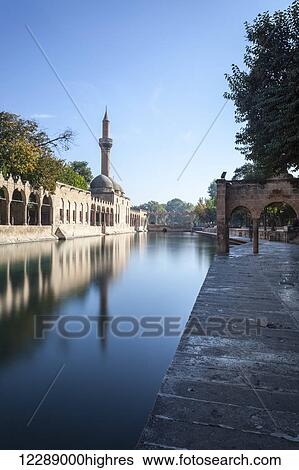 Chamber of Abraham, wall and minaret reflected in the tranquil water of a lake; Sanliurfa, Turkey View Large Photo Image Stock Photograph - Chamber of Abraham, wall and minaret reflected in the tranquil water of a lake; Sanliurfa, Turkey. Fotosearch
