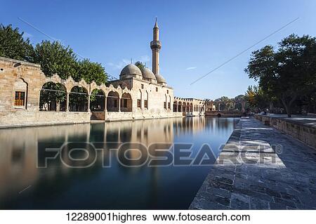 Chamber of Abraham, wall and minaret reflected in the tranquil water of a lake; Sanliurfa, Turkey View Large Photo Image Stock Photograph - Chamber of Abraham, wall and minaret reflected in the tranquil water of a lake; Sanliurfa, Turkey. Fotosearch