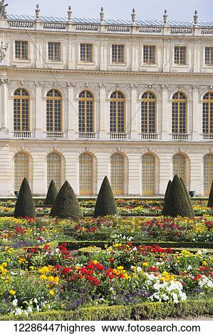 Stock Photograph - Chateau de Versailles, gardens with building in the background; Versailles, France. Fotosearch