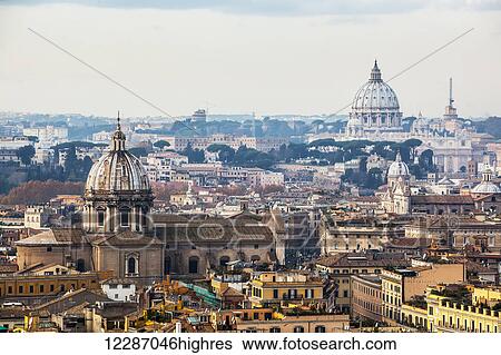 Stock Photograph - Cityscape of Rome with dome of St. Peter's Basilica in the distance; Rome, Italy. Fotosearch