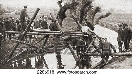 Civilians using their daily trades, in this case bridge building, during WWI. From The Pageant of the Century, published 1934 View Large Photo Image Stock Photo - Civilians using their daily trades, in this case bridge building, during WWI. From The Pageant of the Century, published 1934. Fotosearch