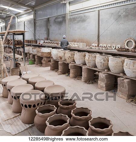 Clay pottery in a row in a warehouse; Dolores Hidalgo, Guanajuato, Mexico View Large Photo Image Stock Photograph - Clay pottery in a row in a warehouse; Dolores Hidalgo, Guanajuato, Mexico. Fotosearch