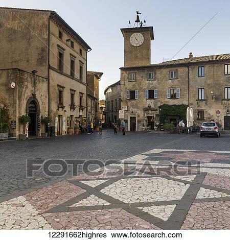 Clock tower and decorative stonework in star of david design on the street; Orvieto, Umbria, Italy View Large Photo Image Stock Photograph - Clock tower and decorative stonework in star of david design on the street; Orvieto, Umbria, Italy. Fotosearch