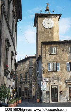 Stock Photograph - Clock tower on a building; Orvieto, Umbria, Italy. Fotosearch