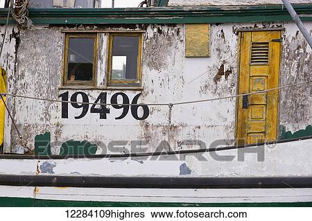 Stock Photograph - Close up of the weathered outside walls of a fishing boat, Sand Point Harbor, Sand Point, Southwestern Alaska, USA, Summer. Fotosearch