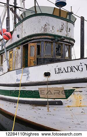 Stock Photograph - Close up of the weathered outside walls and hull of a fishing boat, Sand Point Harbor, Sand Point, Southwestern Alaska, USA, Summer. Fotosearch