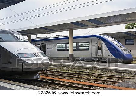 Close up of two streamline trains in train station; Brest, Brittany, France View Large Photo Image Stock Photograph - Close up of two streamline trains in train station; Brest, Brittany, France. Fotosearch