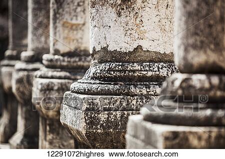 Stock Photograph - Close up of worn ruined columns; Capernaum, Israel. Fotosearch