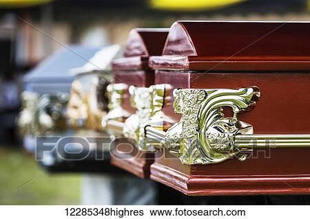Stock Photograph - Coffins with ornate gold detail; Uganda. Fotosearch