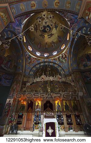 Stock Photograph - Colourful and ornately decorative interior of a church; Capernaum, Israel. Fotosearch