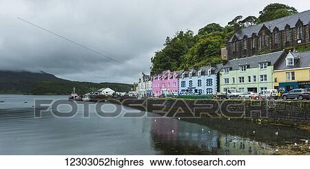 Stock Photograph - Colourful buildings along the harbour; Skye Island, Scotland. Fotosearch