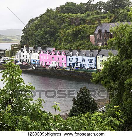 Stock Photograph - Colourful buildings along the harbour, Skye Island; Portree, Scotland. Fotosearch
