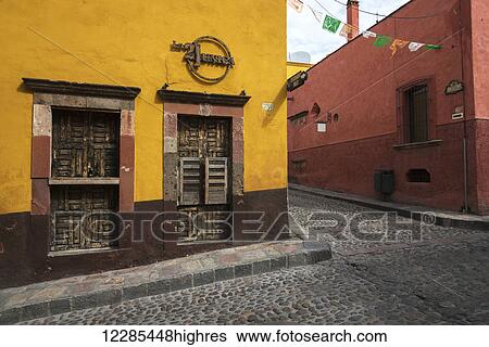 Stock Photograph - Colourful buildings and a cobblestone street; San Miguel de Allende, Guanajuato, Mexico. Fotosearch