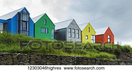 Stock Photograph - Colourful buildings in a row at John O'Groats house; John O'Groats, Scotland. Fotosearch