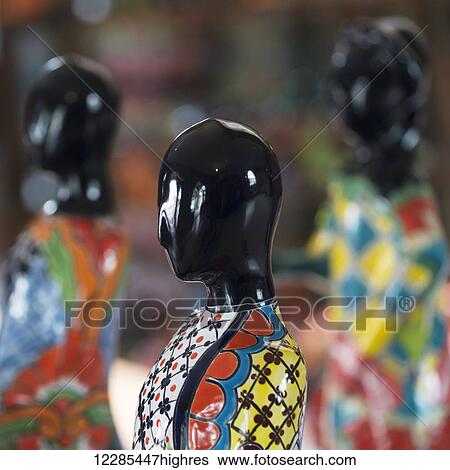 Stock Photograph - Colourful hand painted figure with black head; Dolores Hidalgo, Guanajuato, Mexico. Fotosearch