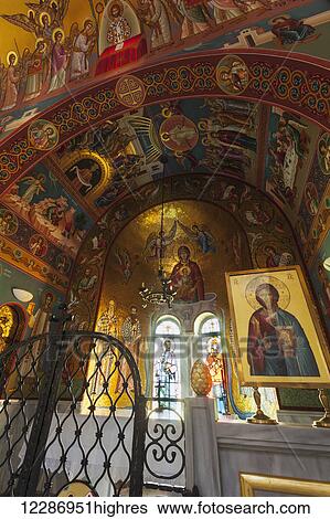 Stock Photograph - Colourful paintings of religious figures in an arch in a church; Philippi, Greece. Fotosearch