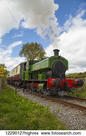 Colourful passenger train on the tracks; Banchory, Aberdeenshire, Scotland View Large Photo Image Stock Photograph - Colourful passenger train on the tracks; Banchory, Aberdeenshire, Scotland. Fotosearch