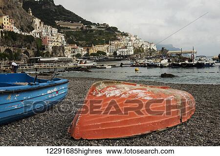 Stock Photograph - Colourful wooden boats on the shore along the Amalfi coast; Amalfi, Campania, Italy. Fotosearch