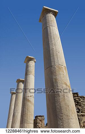 Columns and ruins at archeological site of the island of Delos; Greece View Large Photo Image Stock Photograph - Columns and ruins at archeological site of the island of Delos; Greece. Fotosearch