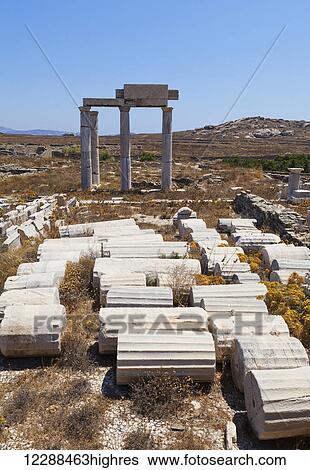 Stock Photograph - Columns and ruins at archeological site of the island of Delos; Greece. Fotosearch