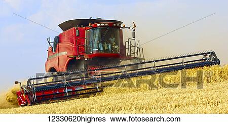 Combine Harvests Grain On The Hills Of The Palouse Region Of Washington; Washington, United States Of America View Large Photo Image Stock Photograph - Combine Harvests Grain On The Hills Of The Palouse Region Of Washington; Washington, United States Of America. Fotosearch