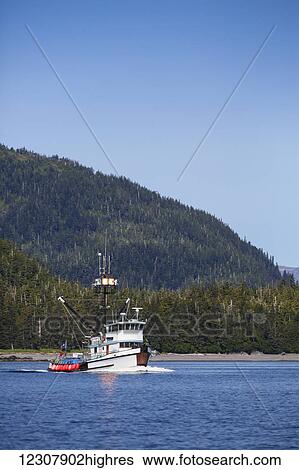 Stock Photograph - Commercial fishing boat on the waters of Main Bay, Prince William Sound, Whittier, Southcentral Alaska, USA, Summer. Fotosearch