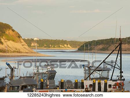 Stock Photograph - Commercial fishing boats on Naknek River, Bristol Bay, Southwest Alaska, Summer. Fotosearch