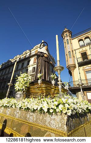 Stock Photograph - Corpus Christi festival, parade with religious statues; Seville, Spain. Fotosearch