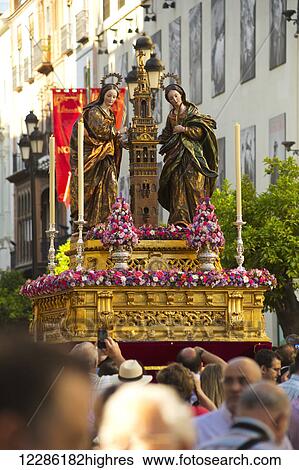 Stock Photograph - Corpus Christi festival, parade with religious statues; Seville, Spain. Fotosearch
