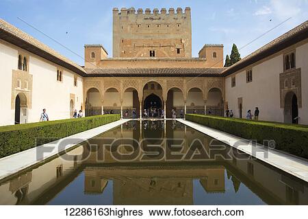 Stock Photograph - Court of the Myrtles (Patio de los Arrayanes) of Nasrid Palace in the Alhambra Palace; Malaga, Spain. Fotosearch