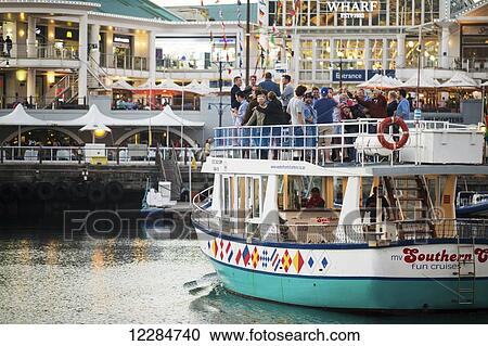 Cruise boat with tourists at the V and A waterfront, downtown Cape Town; Cape Town, Western Cape, South Africa View Large Photo Image Stock Image - Cruise boat with tourists at the V and A waterfront, downtown Cape Town; Cape Town, Western Cape, South Africa. Fotosearch